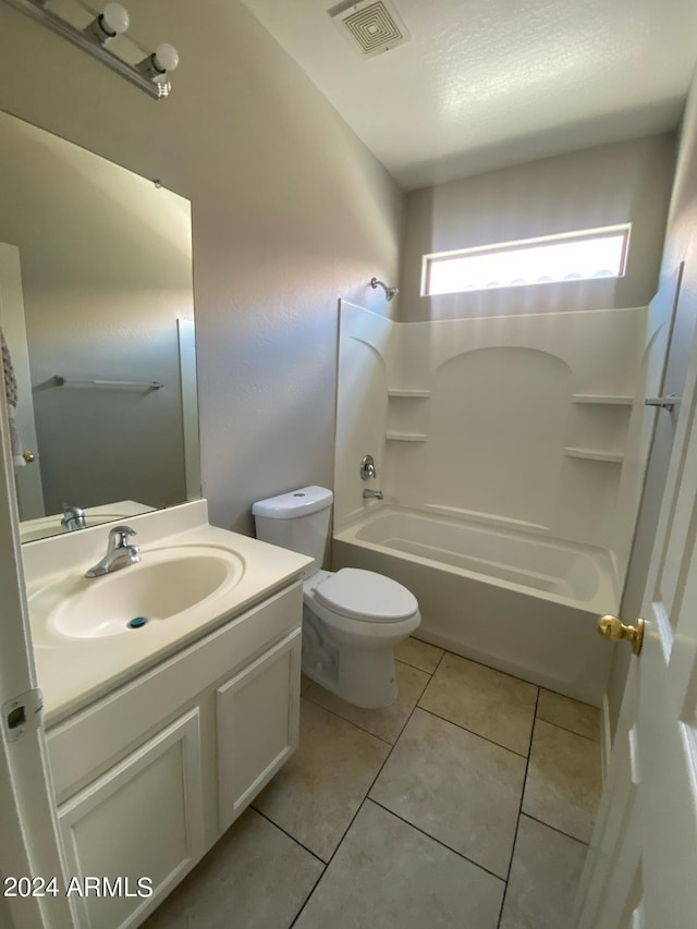 full bathroom with vanity, tile patterned floors, toilet, and shower / bath combination