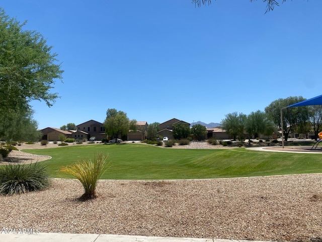 surrounding community featuring a lawn