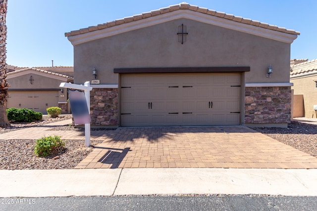 6202 E Mckellips Rd Unit 183, Mesa, AZ 85215 - view of front facade featuring stone siding, stucco siding, a tile roof, and a garage