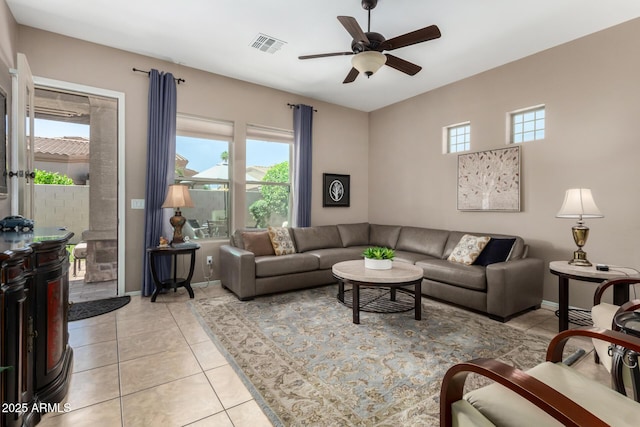 6202 E Mckellips Rd Unit 183, Mesa, AZ 85215 - living room featuring healthy amount of natural light, a ceiling fan, light tile patterned flooring, and baseboards