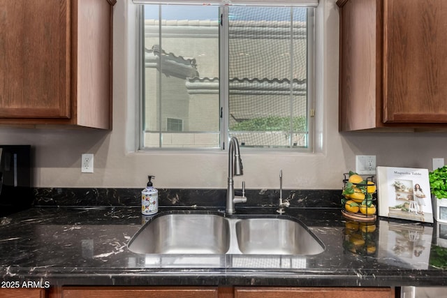 6202 E Mckellips Rd Unit 183, Mesa, AZ 85215 - kitchen featuring a sink, dark stone counters, and brown cabinets