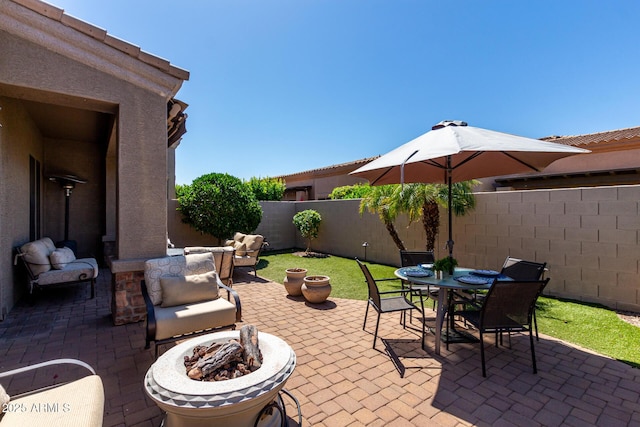 6202 E Mckellips Rd Unit 183, Mesa, AZ 85215 - fenced backyard with an outdoor fire pit, a patio, and outdoor dining space
