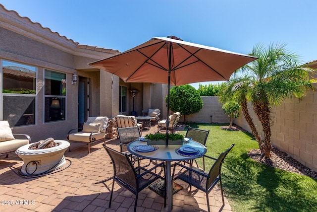 6202 E Mckellips Rd Unit 183, Mesa, AZ 85215 - fenced backyard with a fire pit, a patio, and outdoor dining space