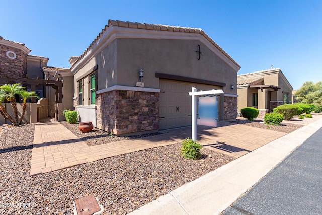 6202 E Mckellips Rd Unit 183, Mesa, AZ 85215 - view of front of house featuring stone siding, stucco siding, and a tiled roof