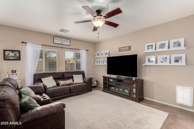 tiled living room with ceiling fan