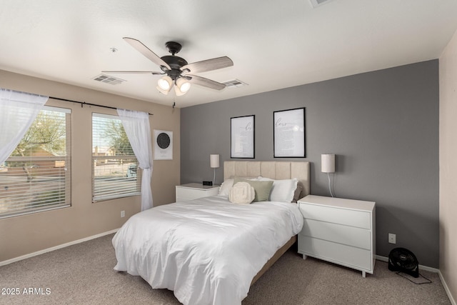 bedroom with light colored carpet and ceiling fan