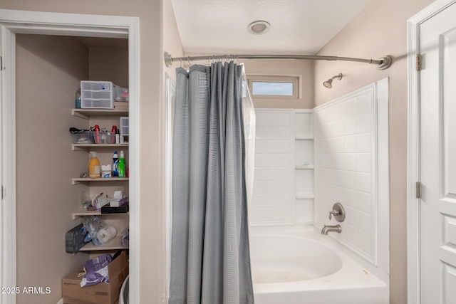 bathroom with shower / tub combo with curtain