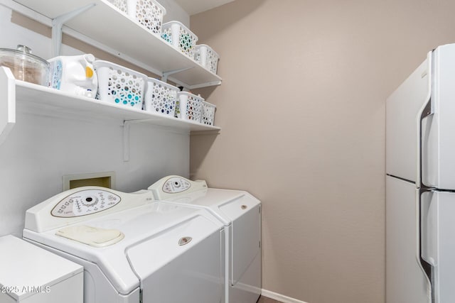 clothes washing area featuring washer and dryer