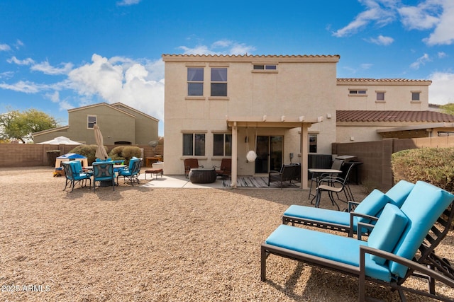 back of property with a patio area