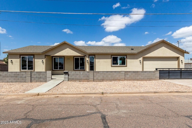1302 W Apache St, Phoenix, AZ 85007 - ranch-style home featuring stucco siding, concrete driveway, an attached garage, and roof with shingles