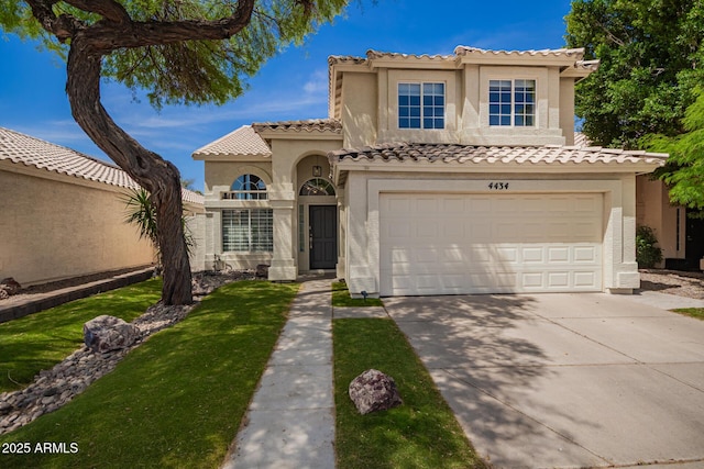 4434 E Bannock St, Phoenix, AZ 85044 - mediterranean / spanish house with stucco siding, concrete driveway, a garage, and a tiled roof