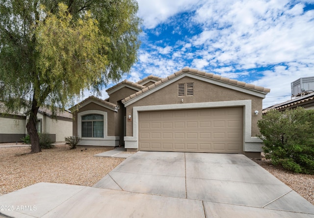 23941 N High Dunes Dr, Florence, AZ 85132 - view of front of house featuring stucco siding, driveway, a garage, and a tiled roof