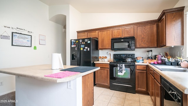 23941 N High Dunes Dr, Florence, AZ 85132 - kitchen featuring a sink, light countertops, black appliances, and light tile patterned floors