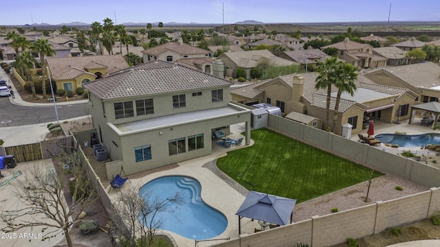 birds eye view of property with a residential view