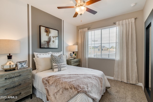 bedroom featuring ceiling fan and carpet