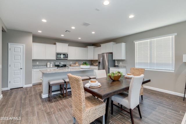 dining room with light hardwood / wood-style flooring