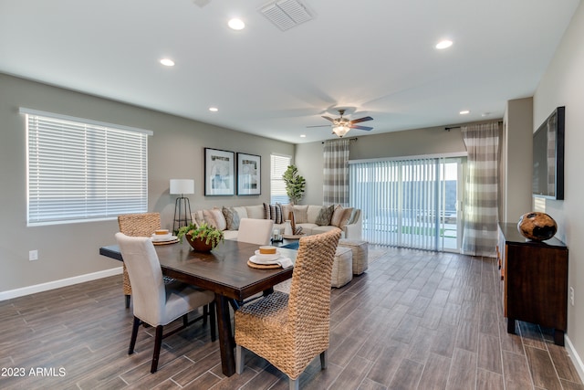 dining room featuring ceiling fan, dark hardwood / wood-style floors, and plenty of natural light