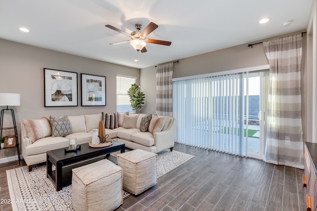 living room with wood-type flooring and ceiling fan