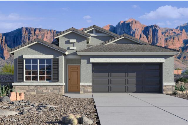 view of front of house with a mountain view and a garage