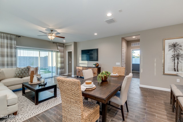 dining room with hardwood / wood-style flooring and ceiling fan