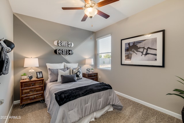 bedroom with lofted ceiling, ceiling fan, and carpet floors