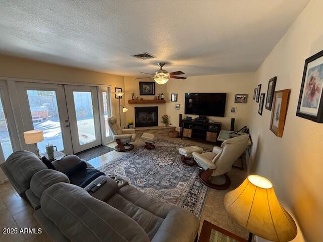 12601 N 34th St, Phoenix, AZ 85032 - living area featuring french doors, a ceiling fan, visible vents, and a textured ceiling