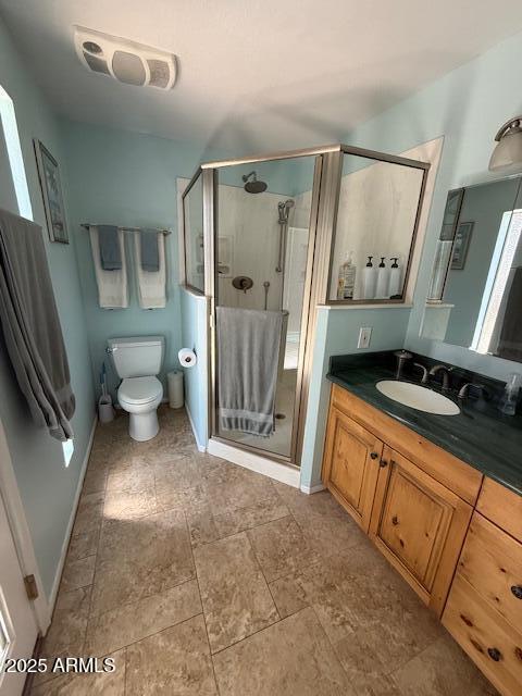 12601 N 34th St, Phoenix, AZ 85032 - bathroom featuring toilet, a stall shower, vanity, and visible vents