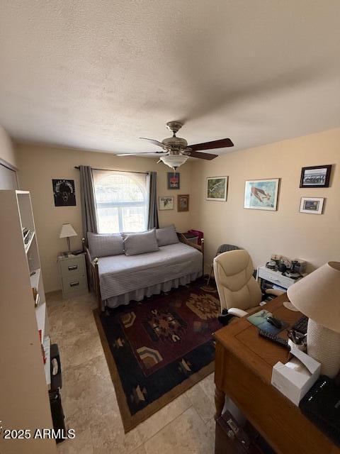 12601 N 34th St, Phoenix, AZ 85032 - bedroom featuring ceiling fan and a textured ceiling