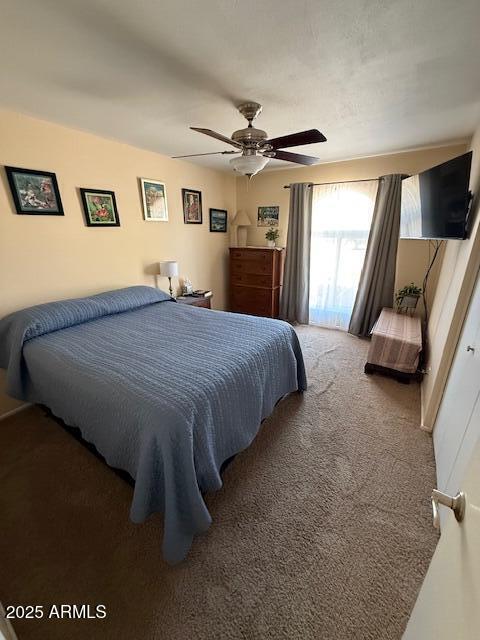 12601 N 34th St, Phoenix, AZ 85032 - carpeted bedroom with a ceiling fan