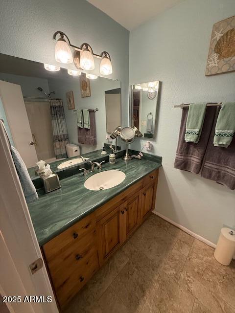 12601 N 34th St, Phoenix, AZ 85032 - full bath with baseboards and vanity