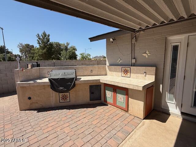 12601 N 34th St, Phoenix, AZ 85032 - view of patio / terrace featuring an outdoor kitchen and fence
