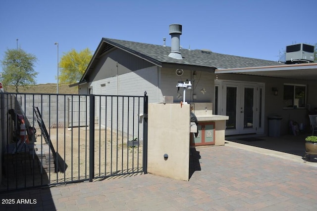 12601 N 34th St, Phoenix, AZ 85032 - view of patio with central AC unit, french doors, fence, and a gate