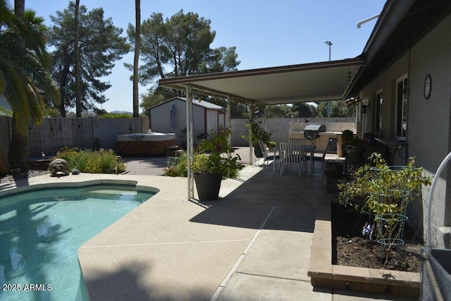 12601 N 34th St, Phoenix, AZ 85032 - view of swimming pool featuring an outbuilding, a hot tub, a storage shed, a fenced backyard, and a patio