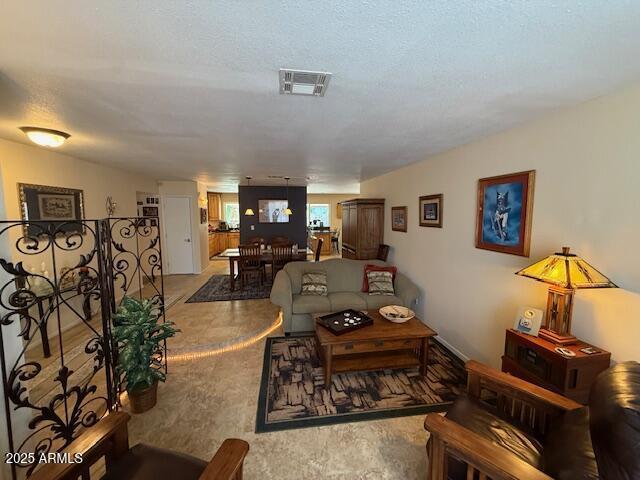 12601 N 34th St, Phoenix, AZ 85032 - living room featuring light carpet and visible vents