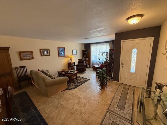 12601 N 34th St, Phoenix, AZ 85032 - entryway with stone finish floor and a textured ceiling