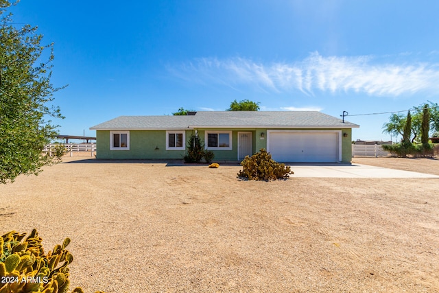 single story home featuring a garage