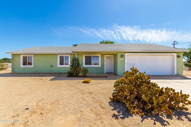 ranch-style home featuring a garage