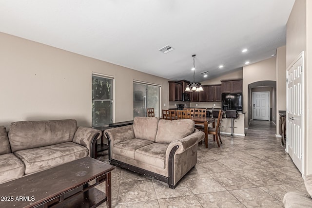 19576 N Portarosa Ct, Maricopa, AZ 85138 - living area with arched walkways, a chandelier, lofted ceiling, and recessed lighting