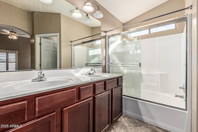 19576 N Portarosa Ct, Maricopa, AZ 85138 - full bath featuring shower / bath combination with glass door, double vanity, vaulted ceiling, and a ceiling fan