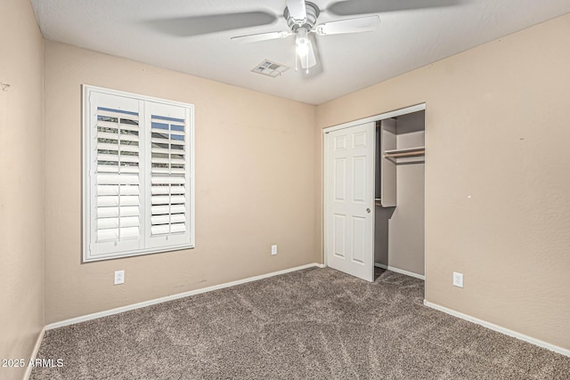 19576 N Portarosa Ct, Maricopa, AZ 85138 - unfurnished bedroom with carpet floors, a closet, baseboards, and a ceiling fan