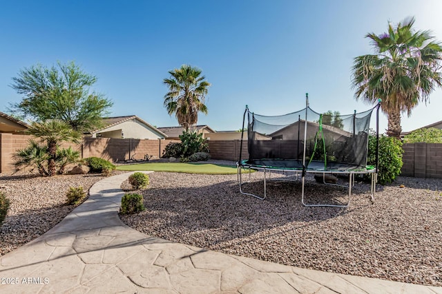 19576 N Portarosa Ct, Maricopa, AZ 85138 - fenced backyard featuring a trampoline