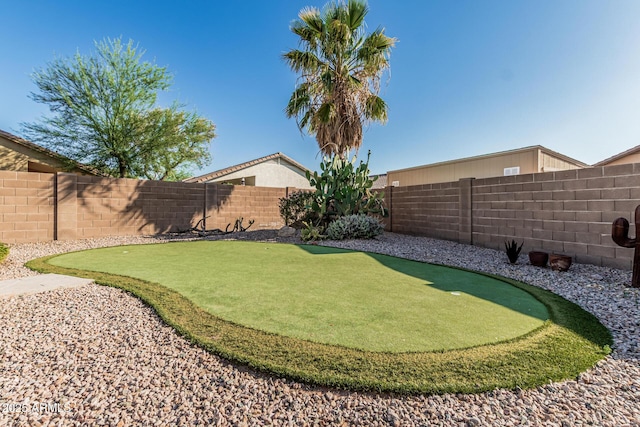 19576 N Portarosa Ct, Maricopa, AZ 85138 - fenced backyard featuring a putting green