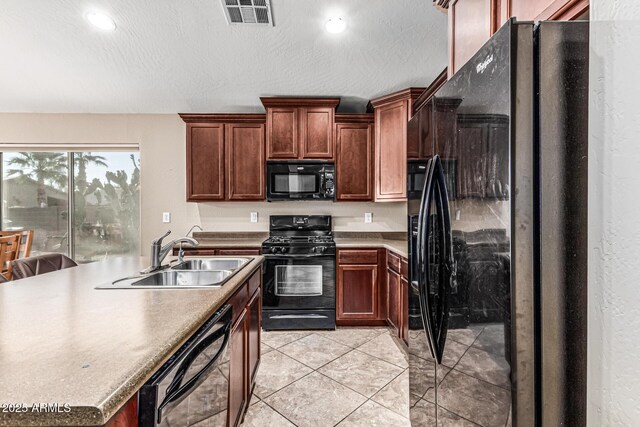 19576 N Portarosa Ct, Maricopa, AZ 85138 - kitchen with black appliances, a sink, light tile patterned floors, recessed lighting, and a textured ceiling