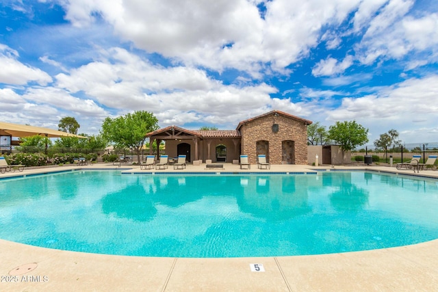 19576 N Portarosa Ct, Maricopa, AZ 85138 - community pool featuring a patio