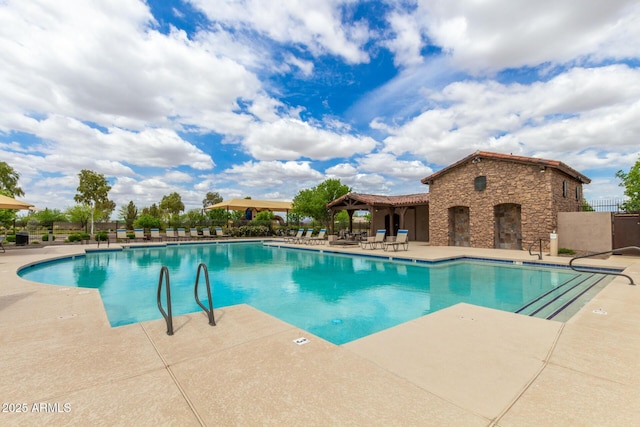 19576 N Portarosa Ct, Maricopa, AZ 85138 - community pool featuring a patio