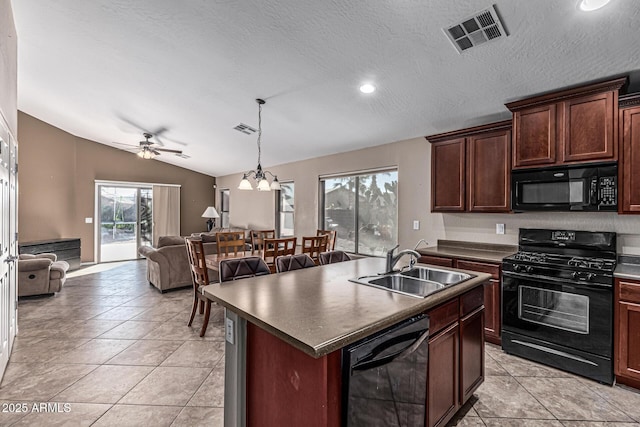 19576 N Portarosa Ct, Maricopa, AZ 85138 - kitchen with black appliances, dark countertops, open floor plan, a sink, and a ceiling fan