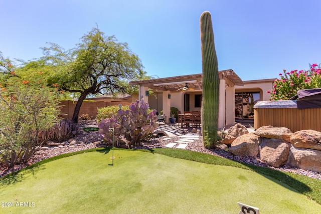 view of yard with a garage, fence, a pergola, and a patio