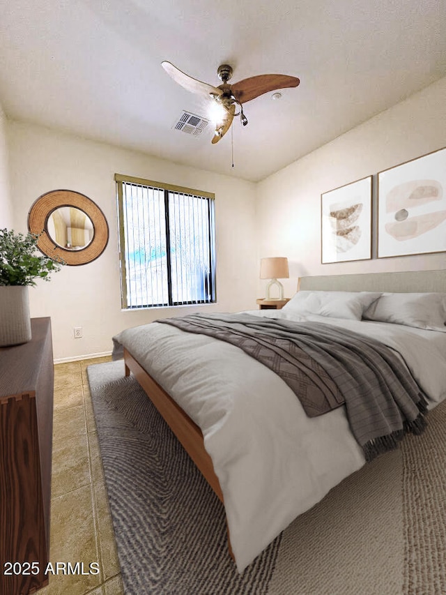 bedroom with visible vents, ceiling fan, and baseboards