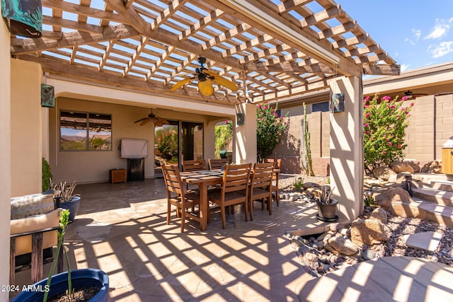 view of patio / terrace with ceiling fan, outdoor dining area, and a pergola