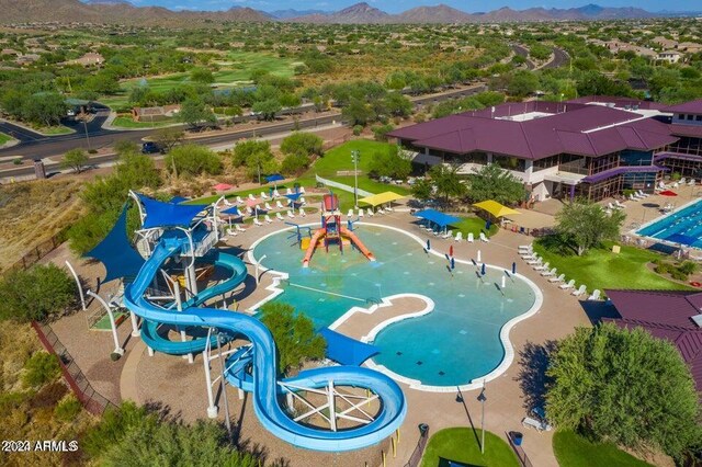 birds eye view of property featuring a mountain view